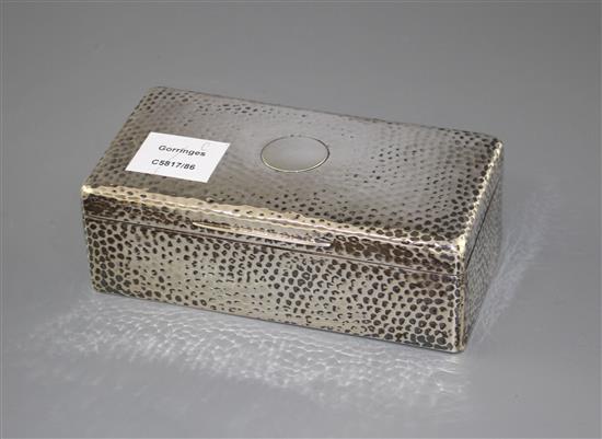An Edwardian planished silver mounted rectangular cigarette box, Joseph Braham, London, 1903, 18cm, gross 21 oz.
